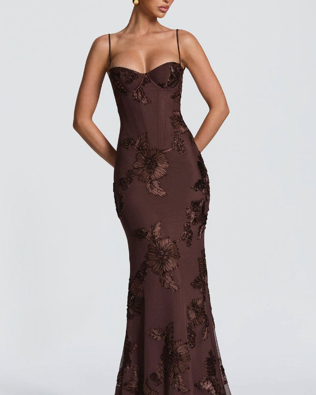 Woman wearing embroidered mermaid maxi dress