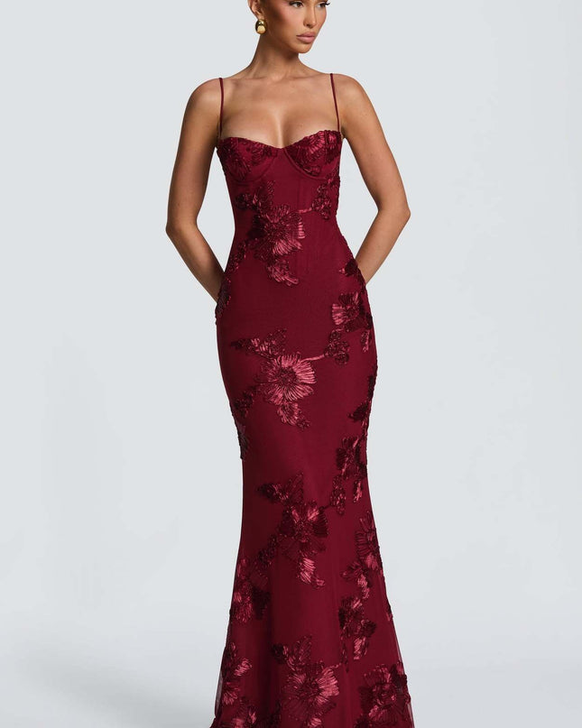 Woman wearing embroidered mermaid maxi dress