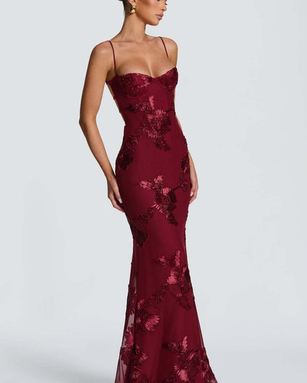 Woman wearing embroidered mermaid maxi dress