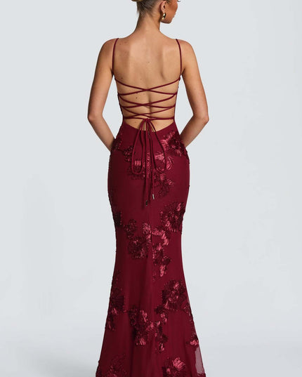 Woman wearing embroidered mermaid maxi dress