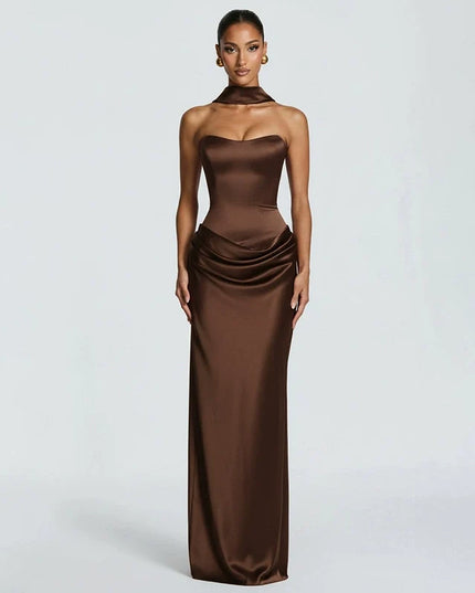 Woman wearing black satin corset maxi dress