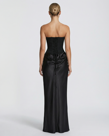 Woman wearing black satin corset maxi dress