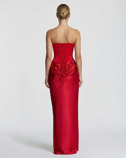 Woman wearing black satin corset maxi dress