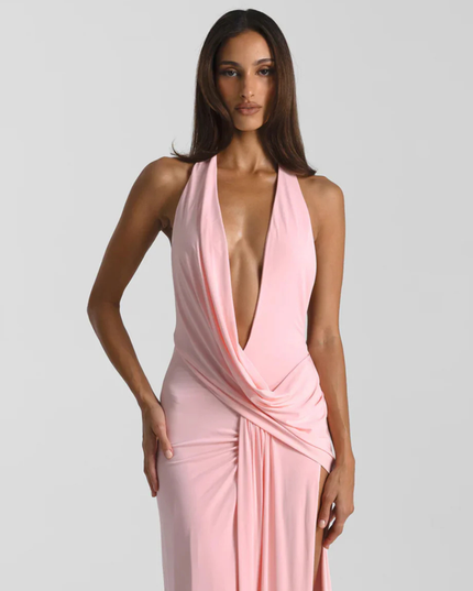 Woman wearing backless satin evening maxi dress
