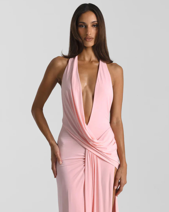 Woman wearing backless satin evening maxi dress