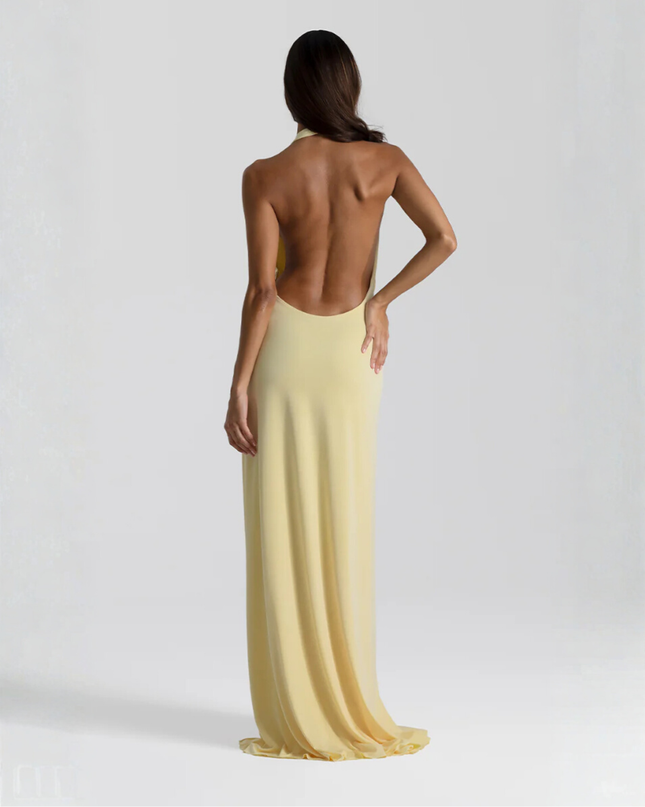 Woman wearing backless satin evening maxi dress