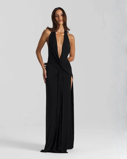 Woman wearing backless satin evening maxi dress