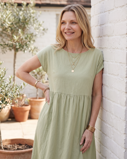 Woman wearing effortless linen midi dress