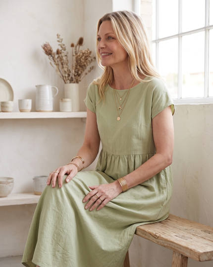 Woman wearing effortless linen midi dress