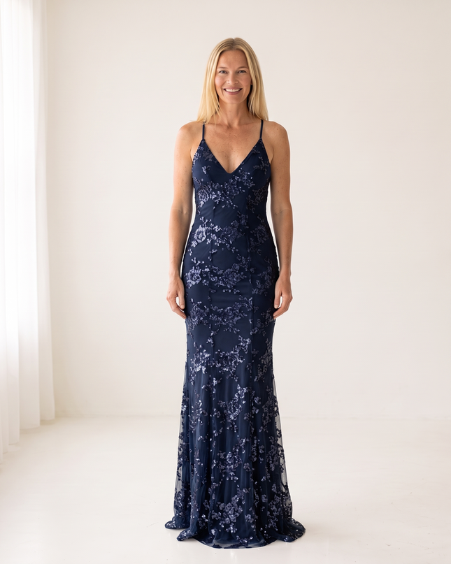 Woman wearing sequin mermaid maxi dress