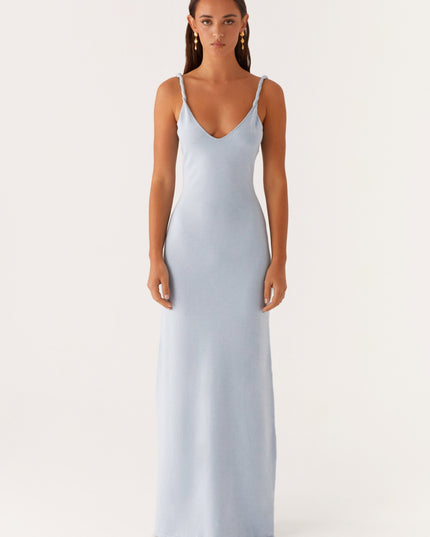 Woman wearing soft blue maxi dress