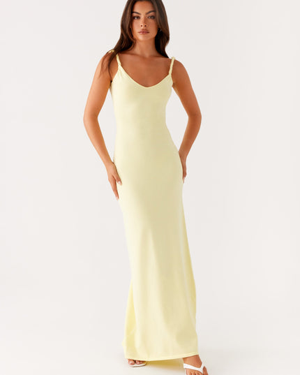 Woman wearing soft blue maxi dress