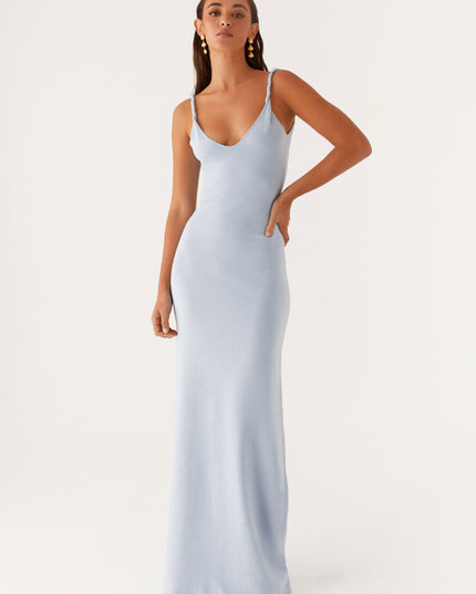 Woman wearing soft blue maxi dress
