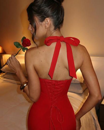 Woman wearing elegant halter midi dress