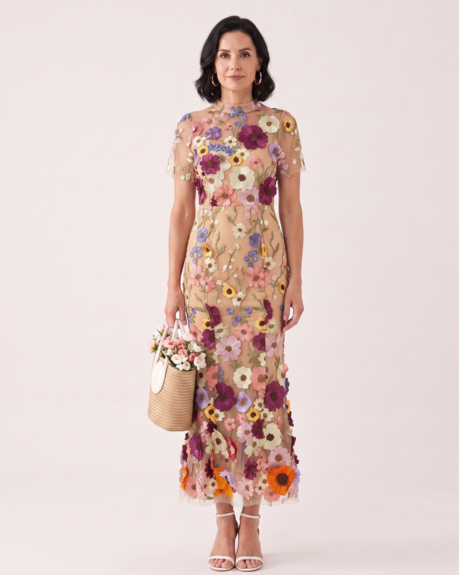 Woman wearing floral embroidered midi dress