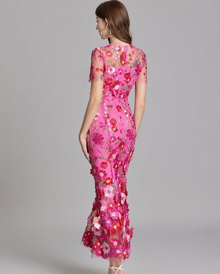 Woman wearing floral embroidered midi dress