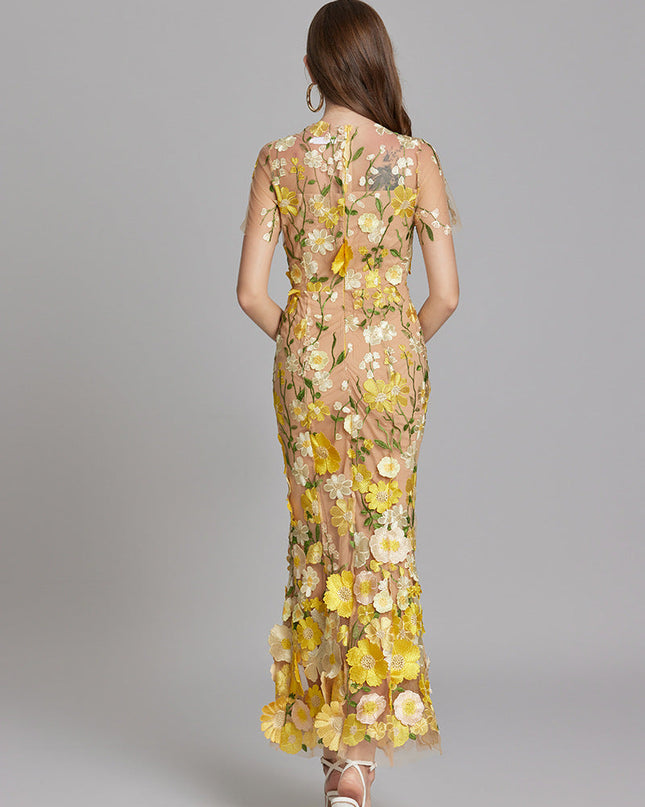 Woman wearing floral embroidered midi dress