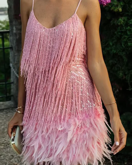 Woman wearing sequin feather mini dress