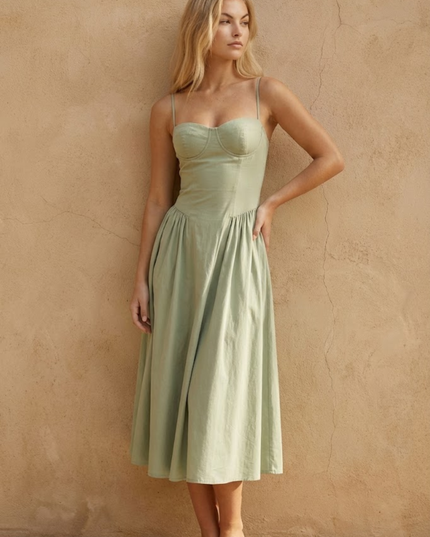 Woman wearing sage green midi dress