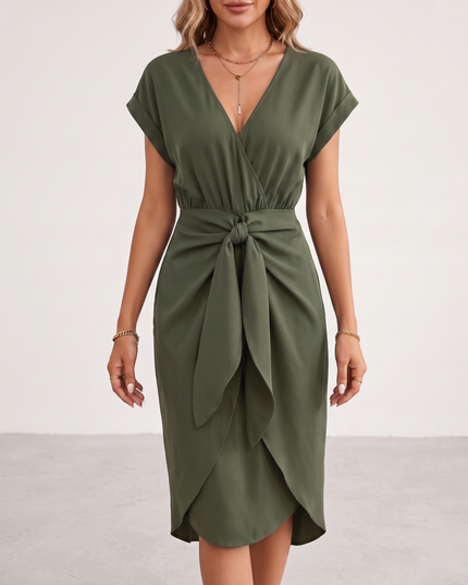 Woman wearing midi wrap dress with tie waist