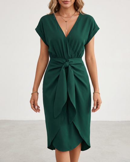 Woman wearing midi wrap dress with tie waist