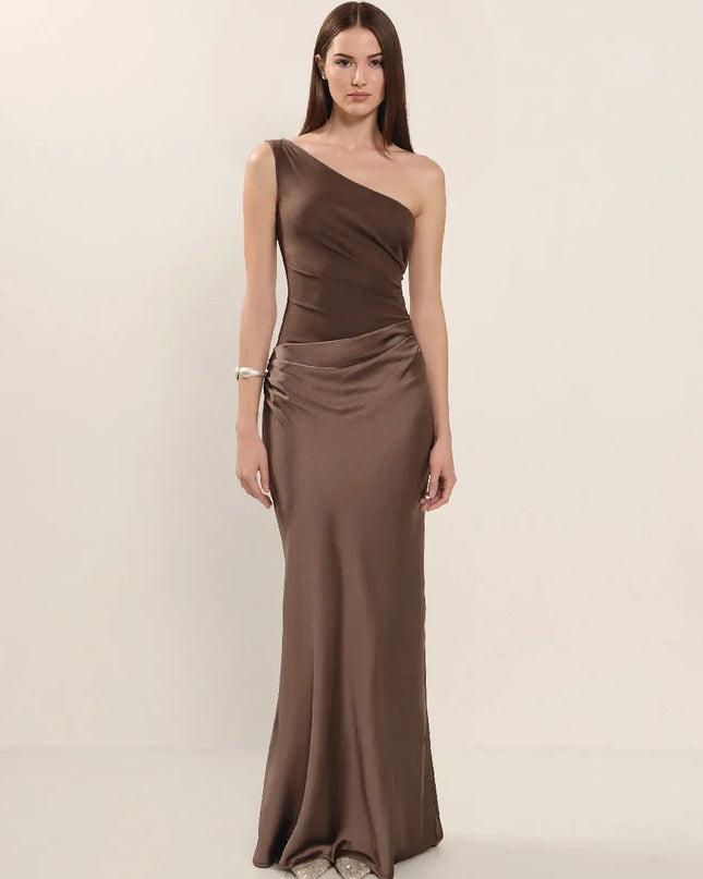 Woman wearing one-shoulder satin evening dress