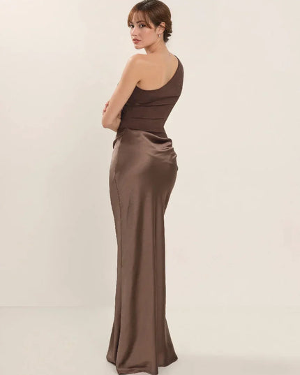 Woman wearing one-shoulder satin evening dress
