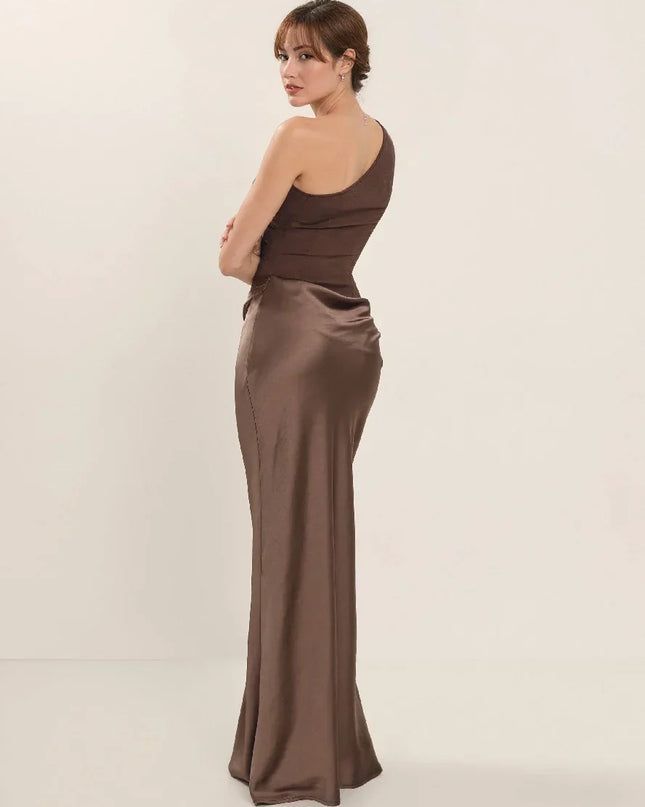Woman wearing one-shoulder satin evening dress