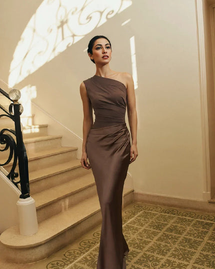 Woman wearing one-shoulder satin evening dress