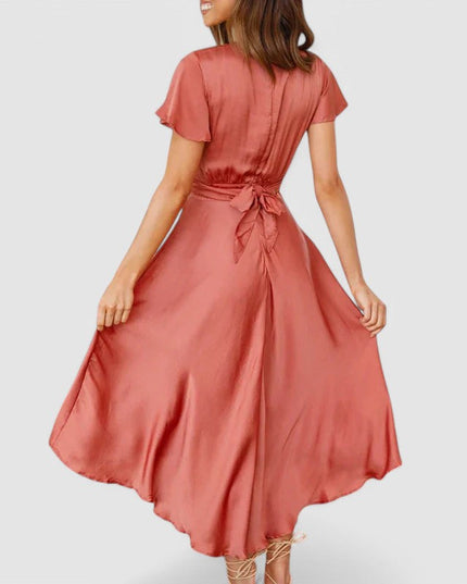 Woman wearing flowing wrap midi dress